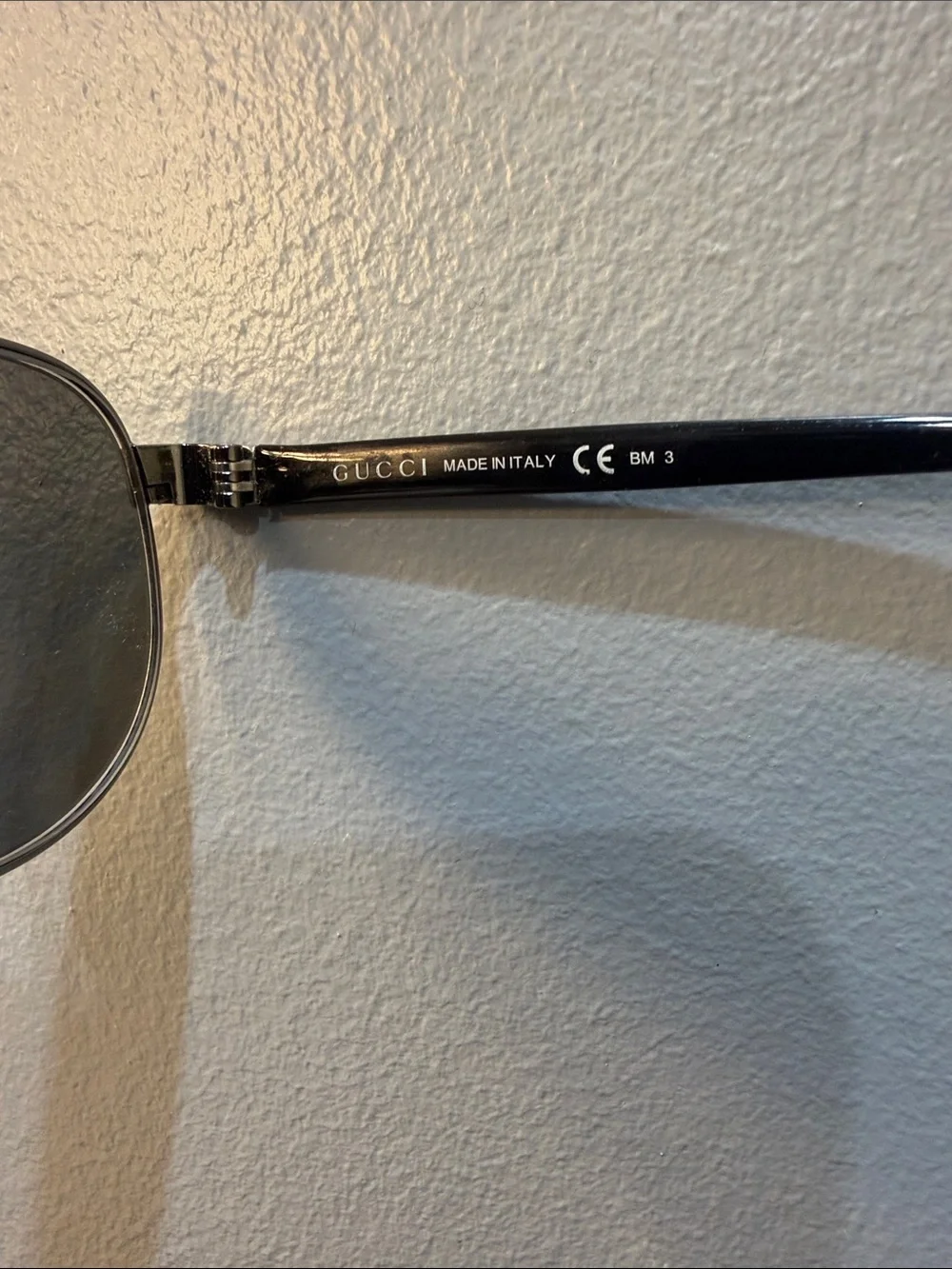 Gucci Men's Black Oval Sunglasses with Silver Accents